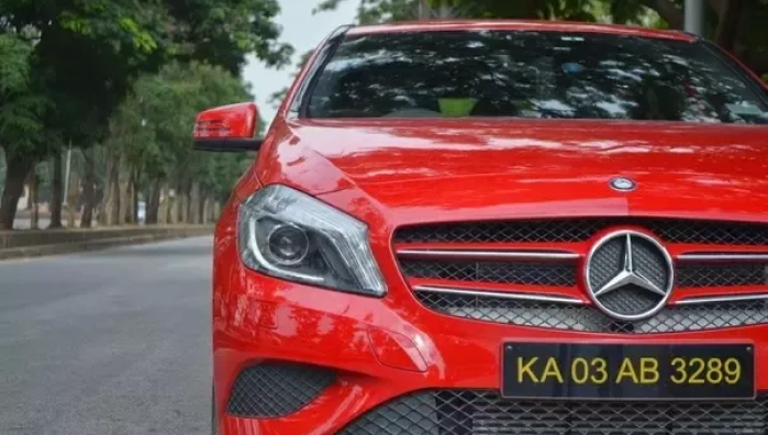 Black Number Plate with yellow letters in India