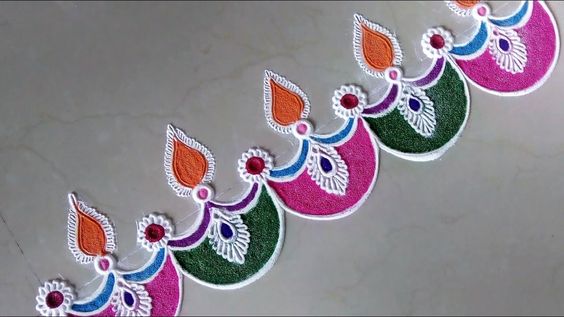 diya border rangoli designs