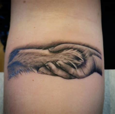 Simple and Small Dog Paw tattoo 